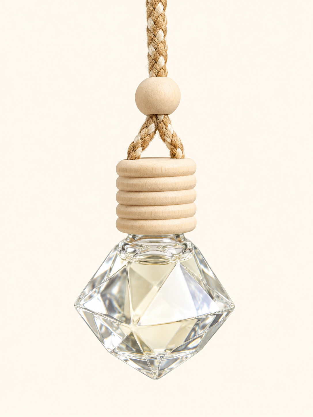 Diamond-shaped clear glass car diffuser with wooden cap and braided cord