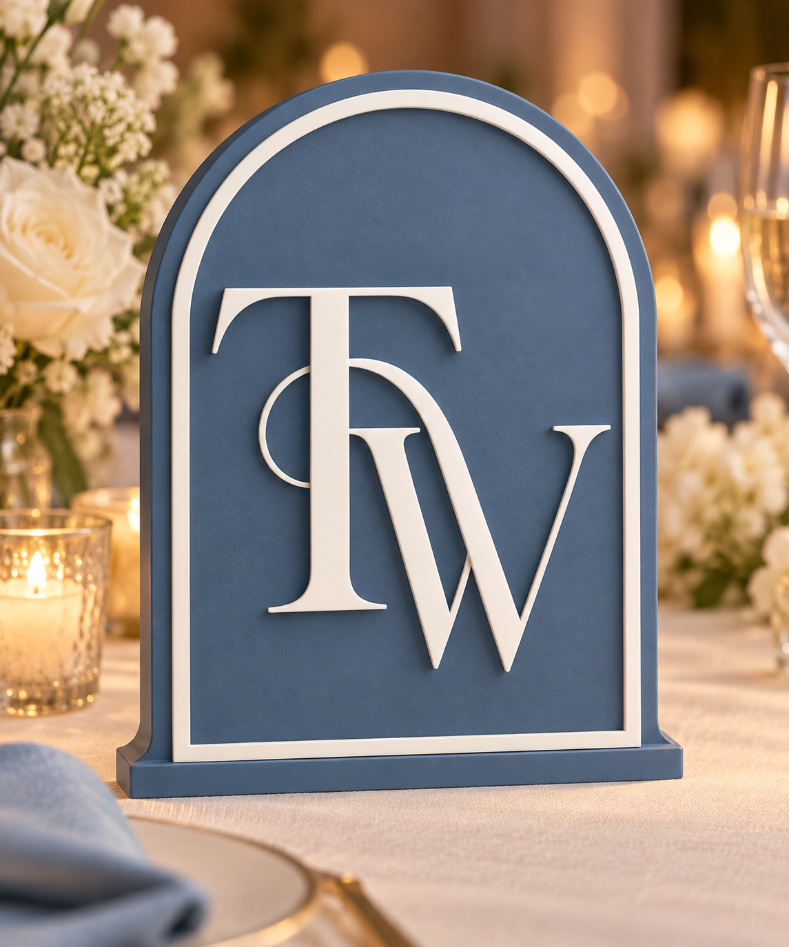 Elegant Arch monogram style in dusty blue with white intertwined initials and border — styled design mockup