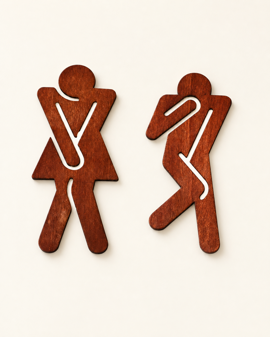Funny wooden restroom signs, paired male and female figures on an ivory background