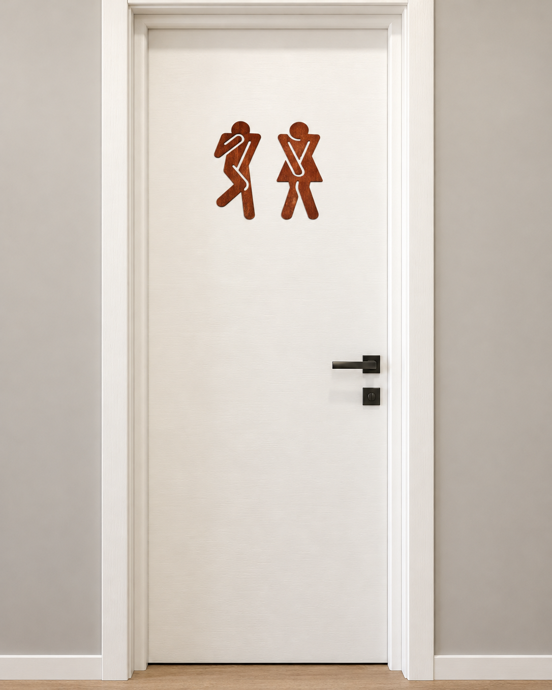 Restroom sign pair shown together on a white bathroom door