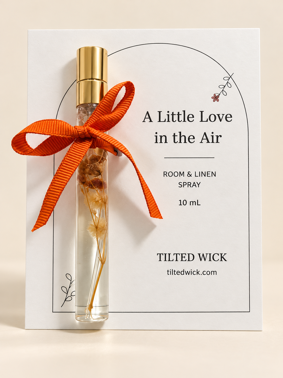 10 mL room and linen spray favor with orange bow and personalized A Little Love in the Air backing card